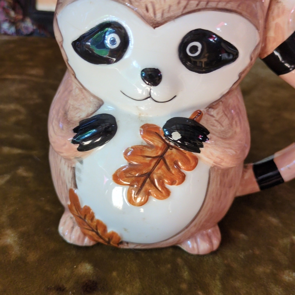 Cute Raccoon Mug with Leaf Design